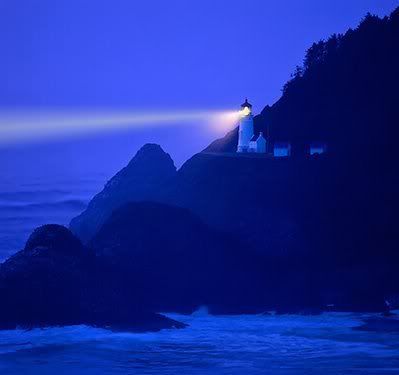 Lighthouse-beams-night-sea.jpg